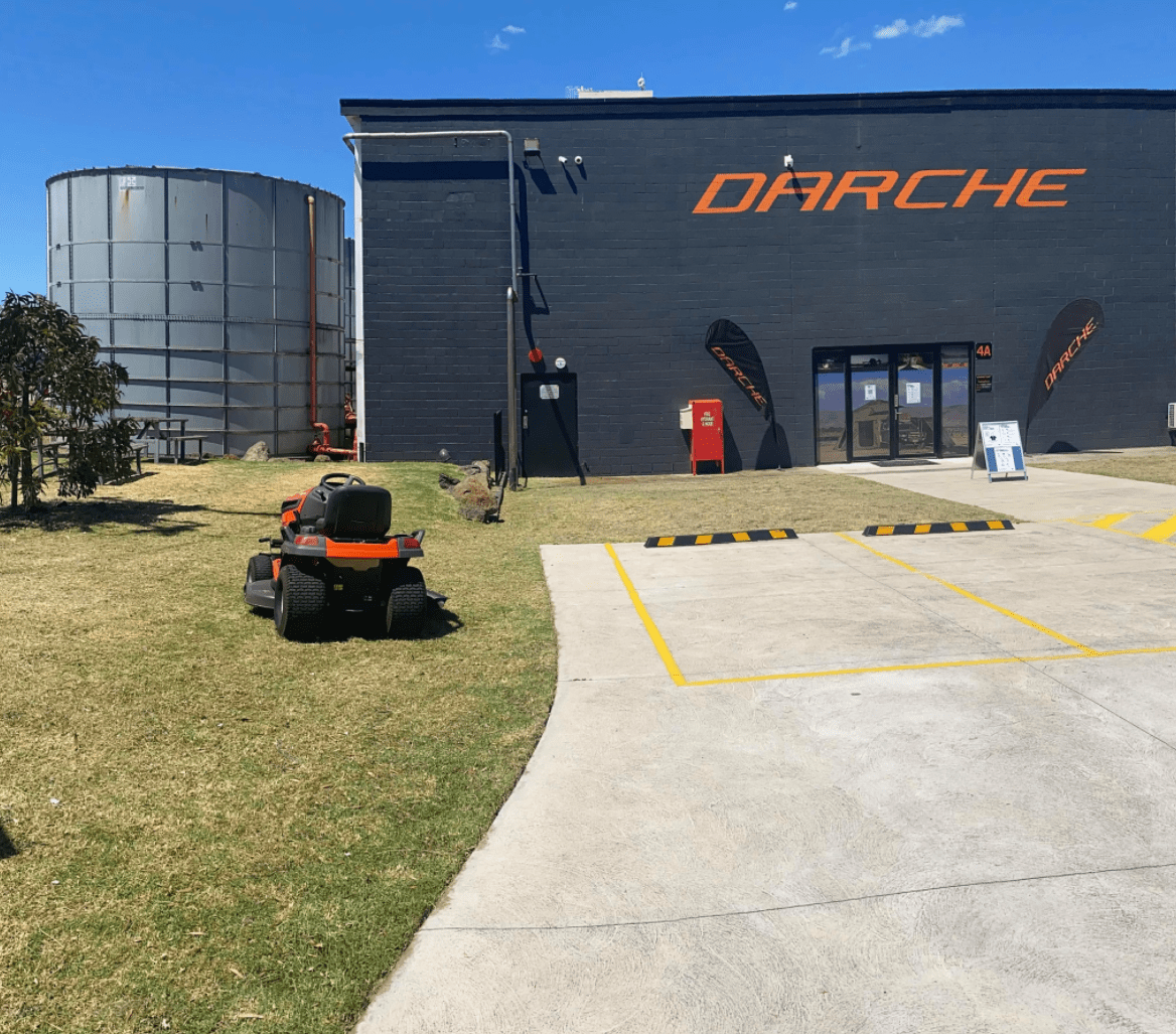 Darche storefront with lawn mower and silo